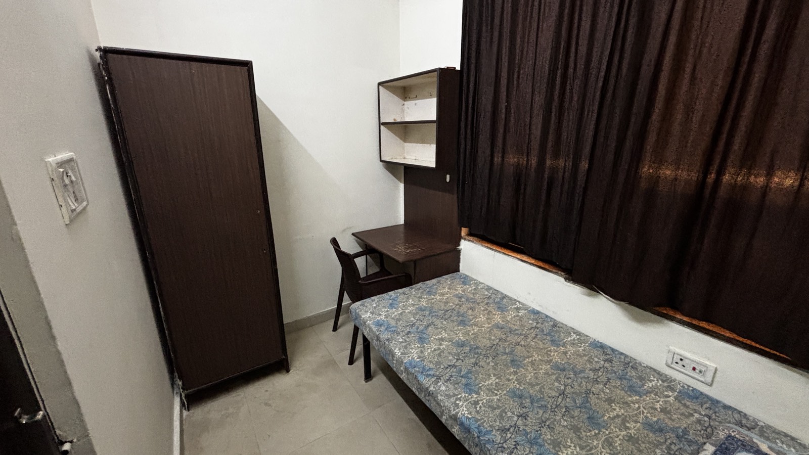 Furnished room with bed and wardrobes at Maya Residency Rajiv Gandhi Nagar